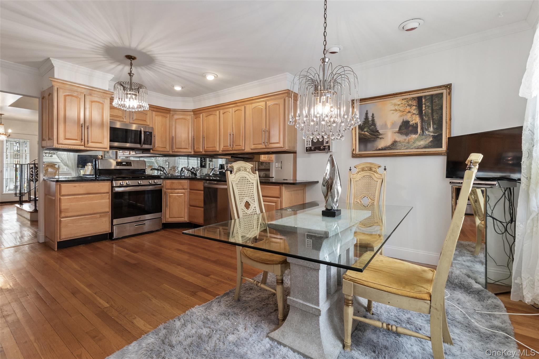 20 Old Farm Road Scarsdale, NY 10583 - Photo 13 of 40 a view of a dining room with furniture wooden floor and chandelier