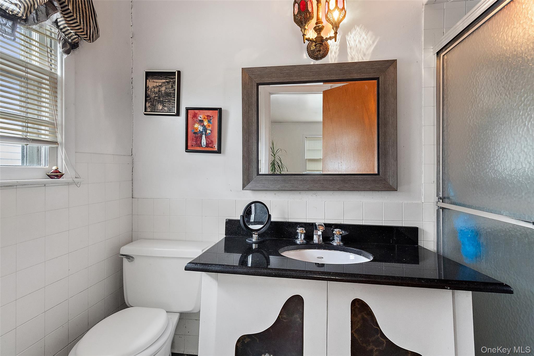 20 Old Farm Road Scarsdale, NY 10583 - Photo 18 of 40 a bathroom with a toilet sink and mirror