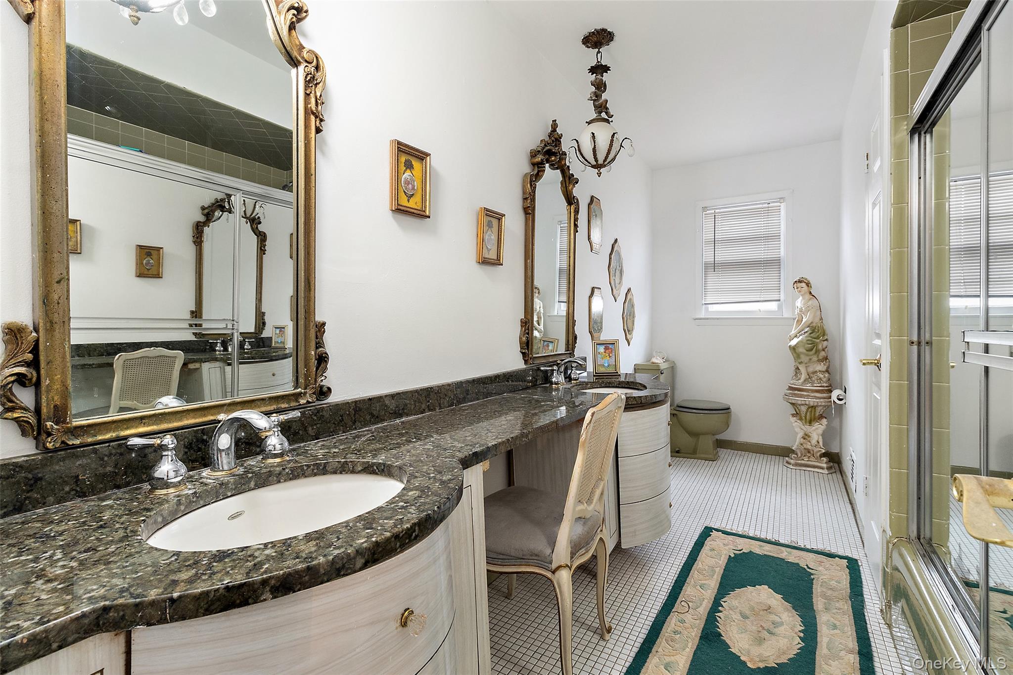 20 Old Farm Road Scarsdale, NY 10583 - Photo 28 of 40 a bathroom with a granite countertop double vanity sink a mirror and a shower