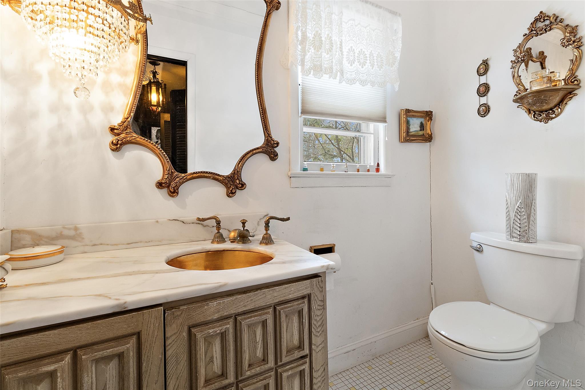20 Old Farm Road Scarsdale, NY 10583 - Photo 33 of 40 a bathroom with a sink a toilet and a mirror