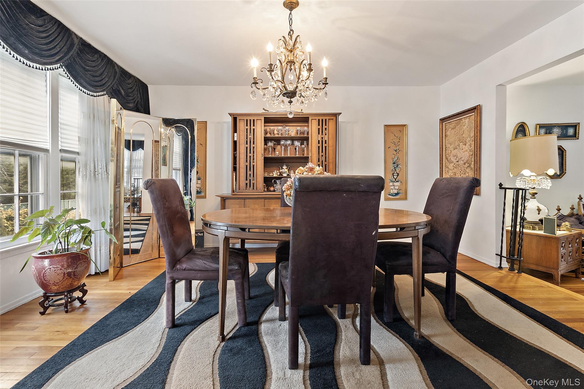 20 Old Farm Road Scarsdale, NY 10583 - Photo 10 of 40 a view of a dining room with furniture window and wooden floor