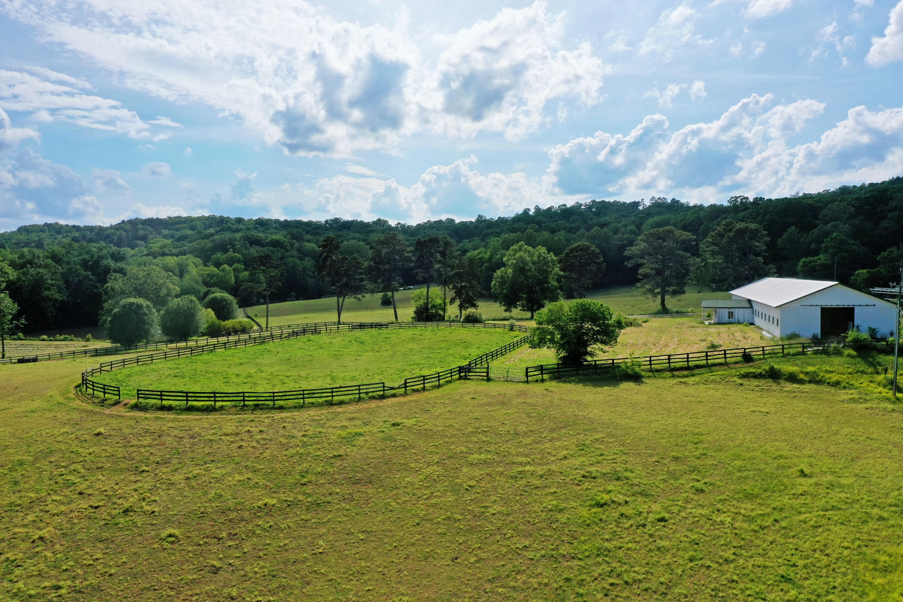 490 Hutcheson Road, Unit TRACT A Flintstone, GA 30725 - Photo 24 of 35 Barn and dressage towards main house