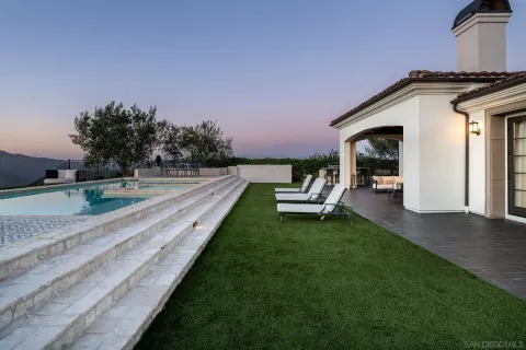 a view of yard with outdoor seating and ocean view