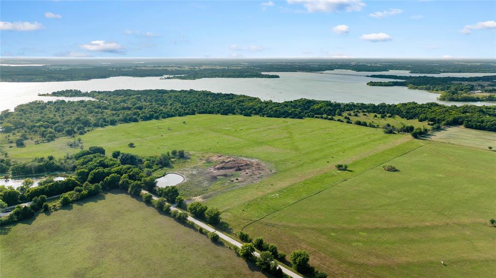0 West Hinton Street Tioga, TX 76271 - Photo 8 of 8 a view of a lake with a mountain