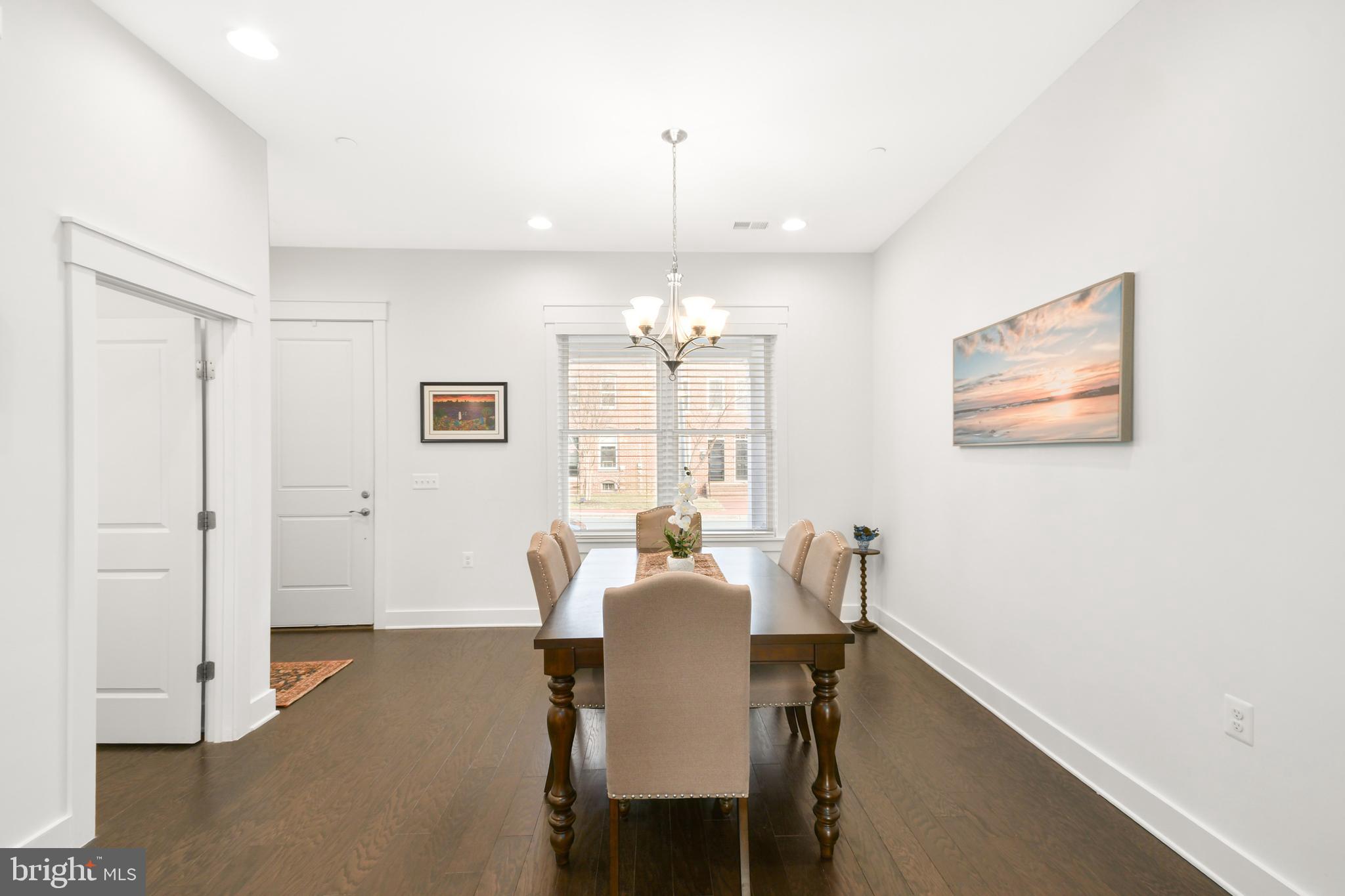 224 East 6th Street Frederick, MD 21701 - Photo 12 of 55 a view of a dining room with furniture window and wooden floor