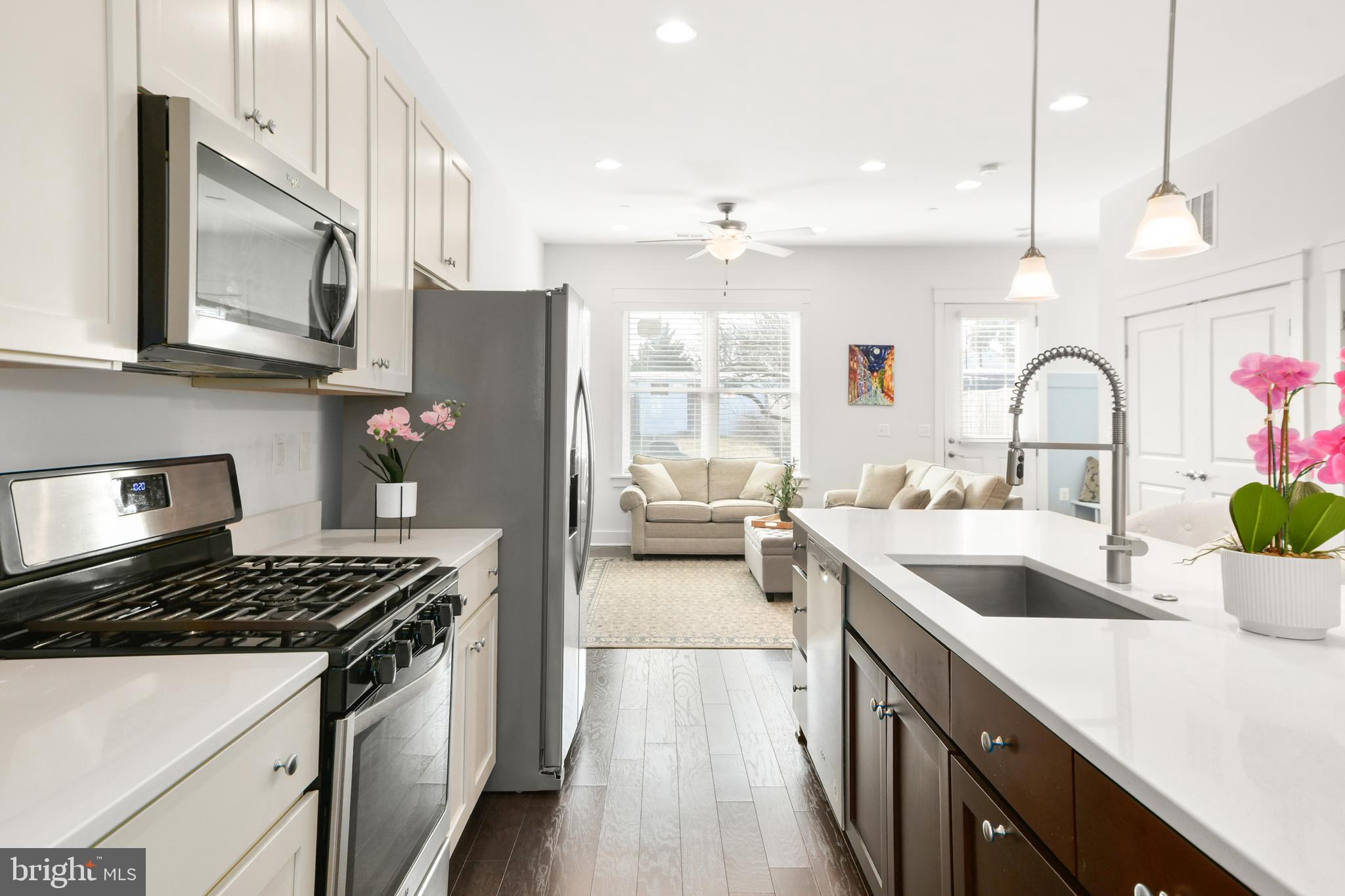 224 East 6th Street Frederick, MD 21701 - Photo 22 of 55 a kitchen with stainless steel appliances a sink stove and refrigerator