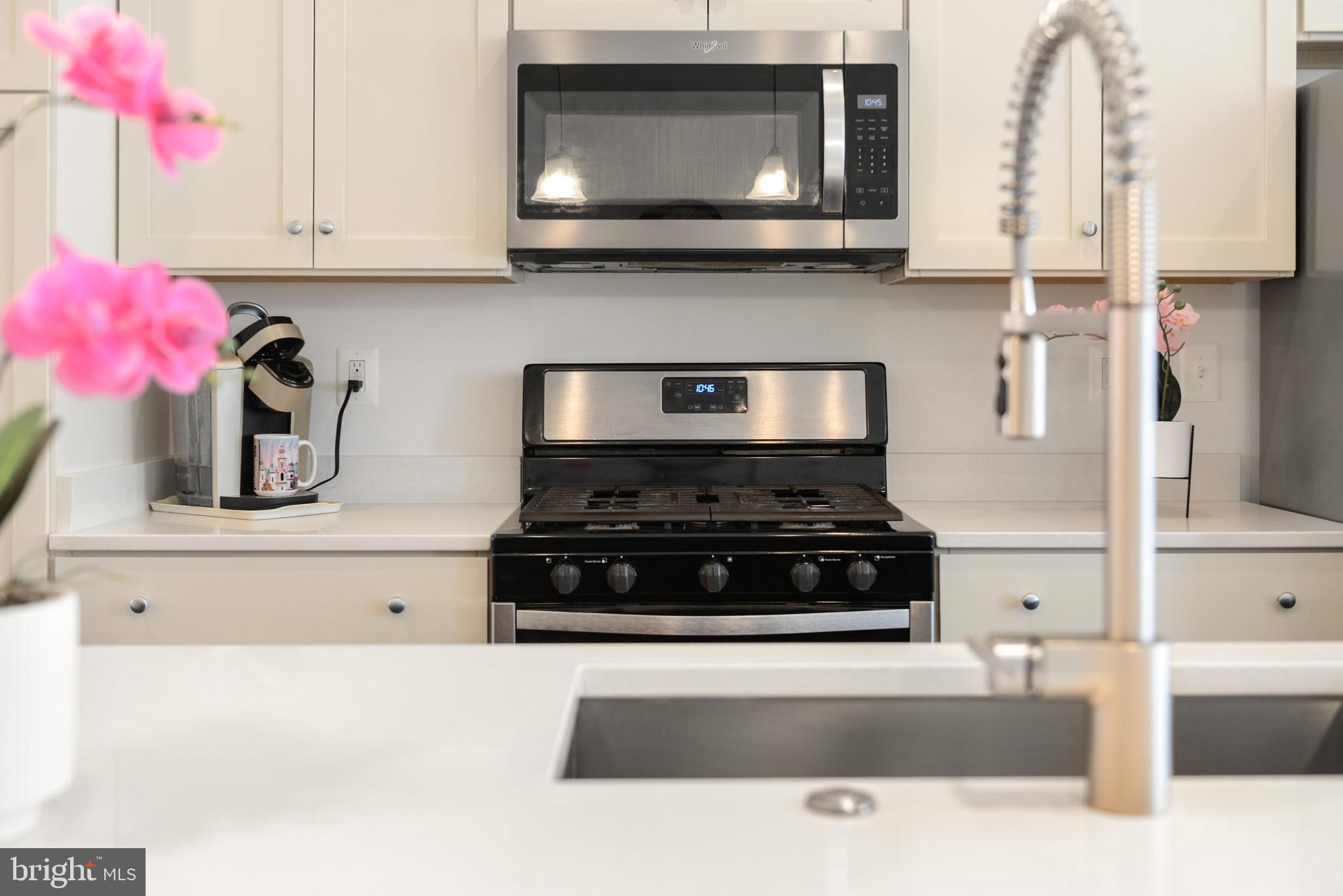 224 East 6th Street Frederick, MD 21701 - Photo 23 of 55 a kitchen with a stove and a microwave