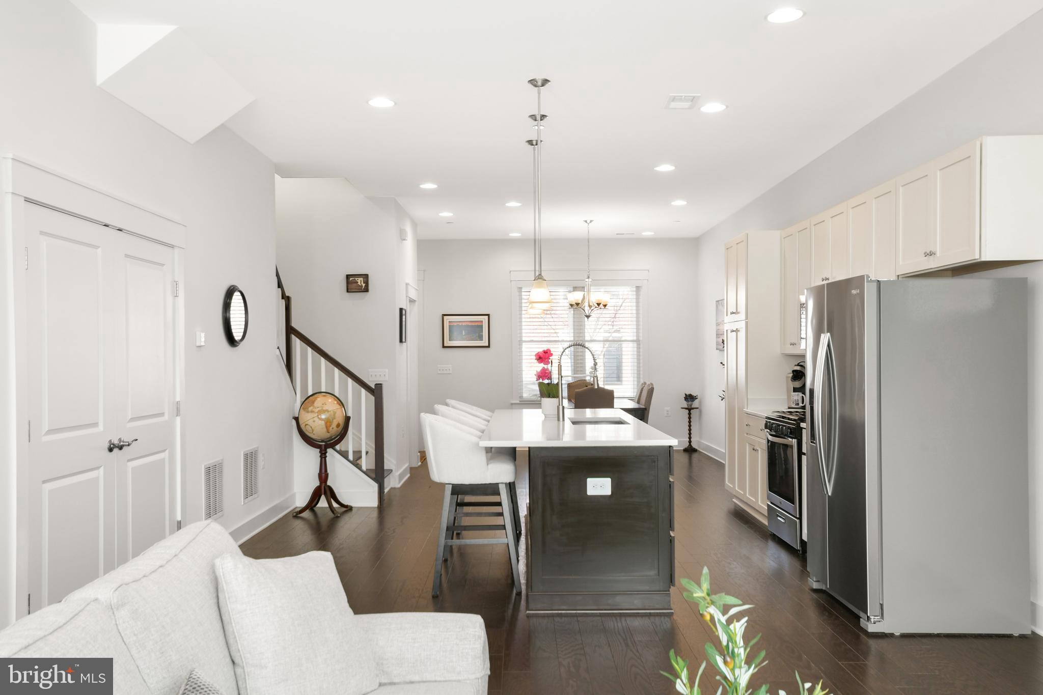 224 East 6th Street Frederick, MD 21701 - Photo 29 of 55 a kitchen with a refrigerator a sink and a stove
