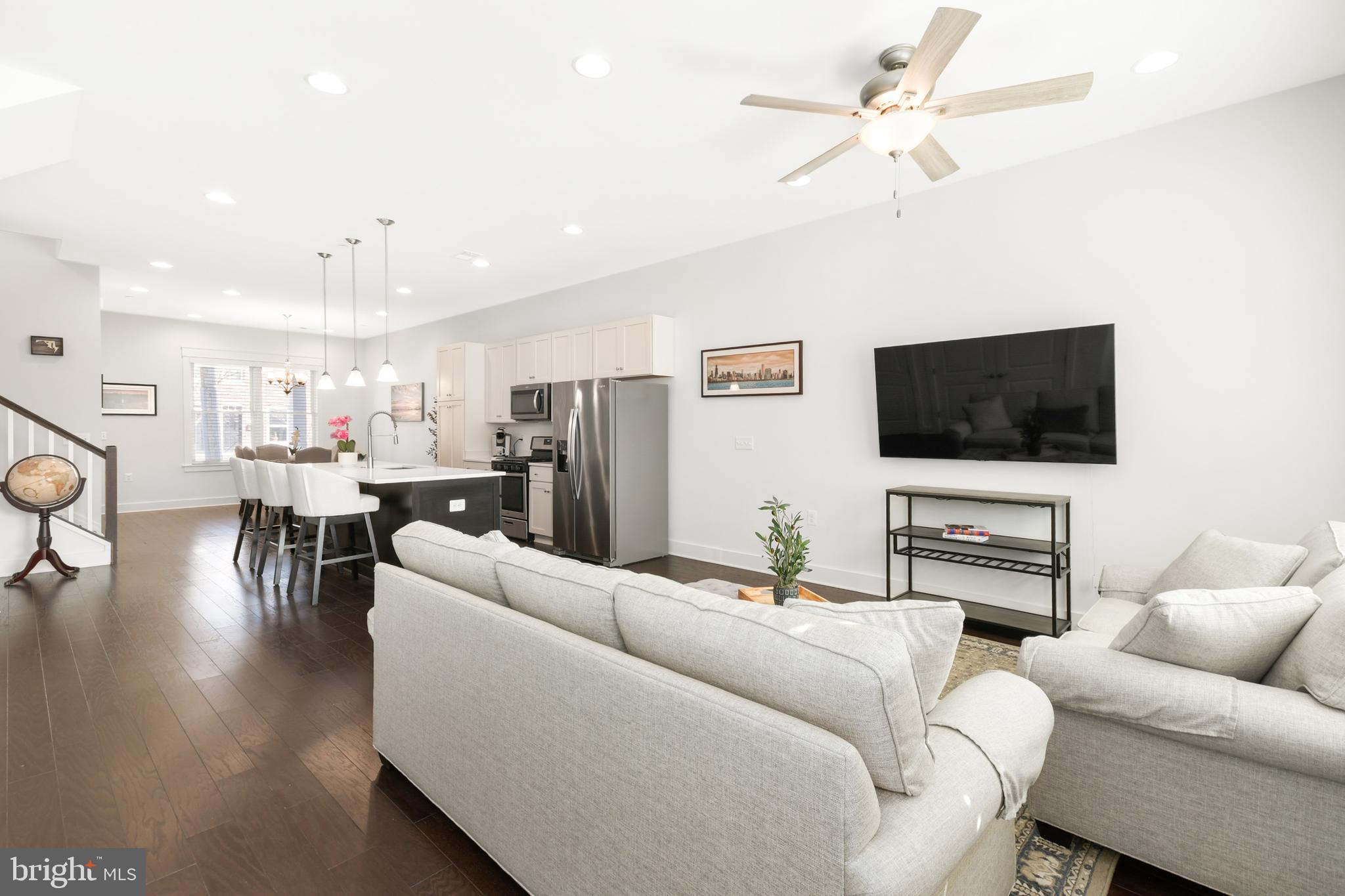 224 East 6th Street Frederick, MD 21701 - Photo 30 of 55 a living room with furniture and a flat screen tv