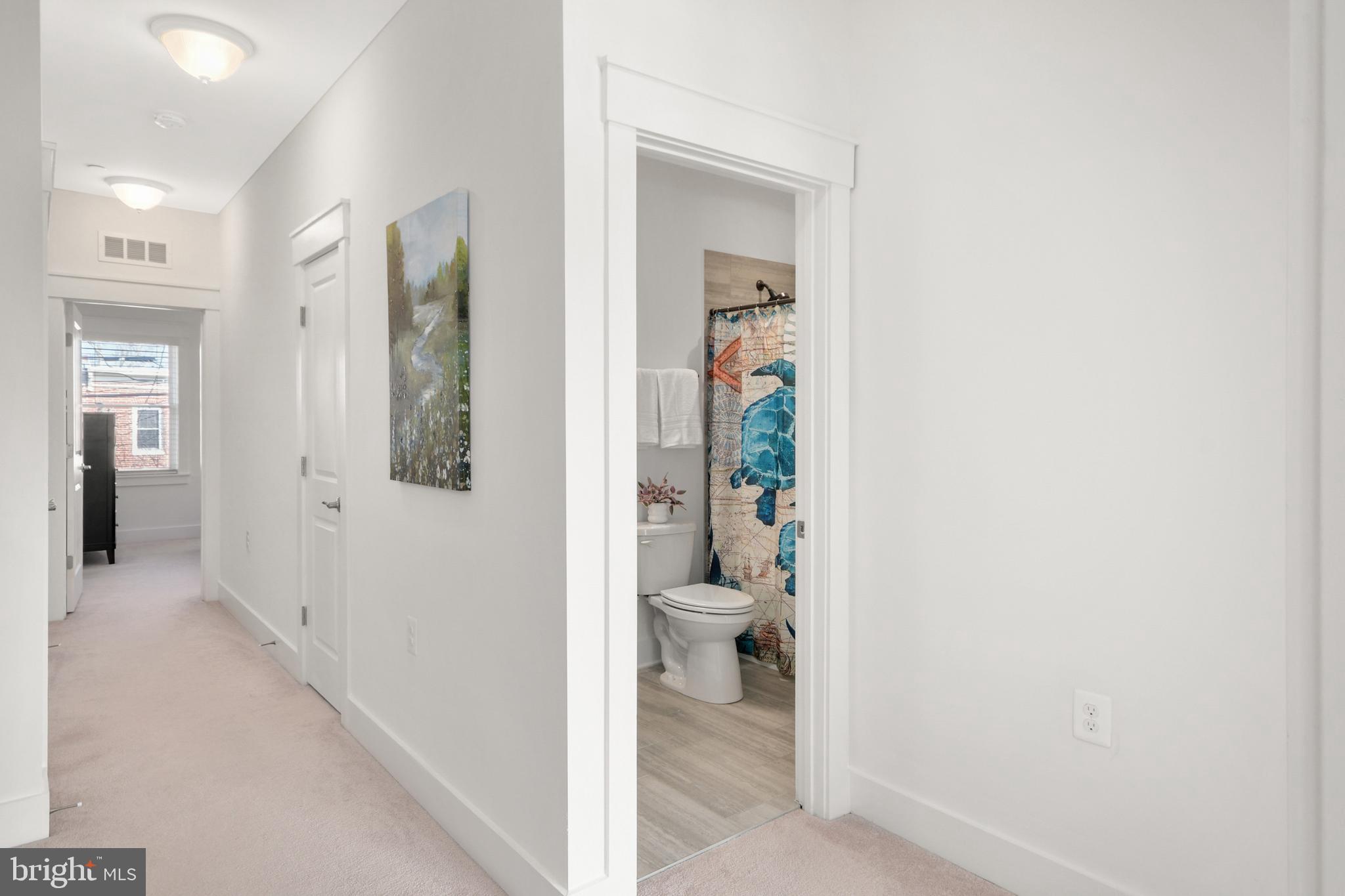 224 East 6th Street Frederick, MD 21701 - Photo 32 of 55 a bathroom with a toilet and a shower