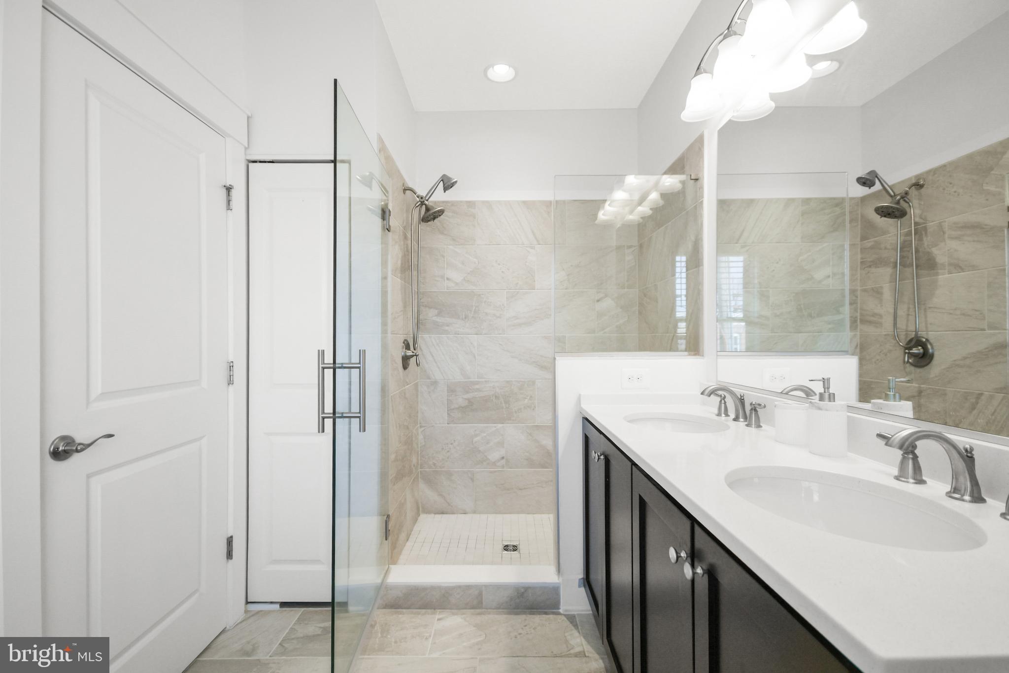224 East 6th Street Frederick, MD 21701 - Photo 37 of 55 a bathroom with a double vanity sink mirror double and shower