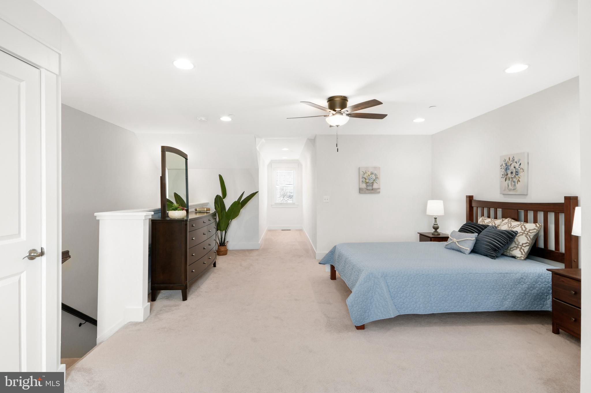 224 East 6th Street Frederick, MD 21701 - Photo 44 of 55 a bedroom with a bed and a chandelier