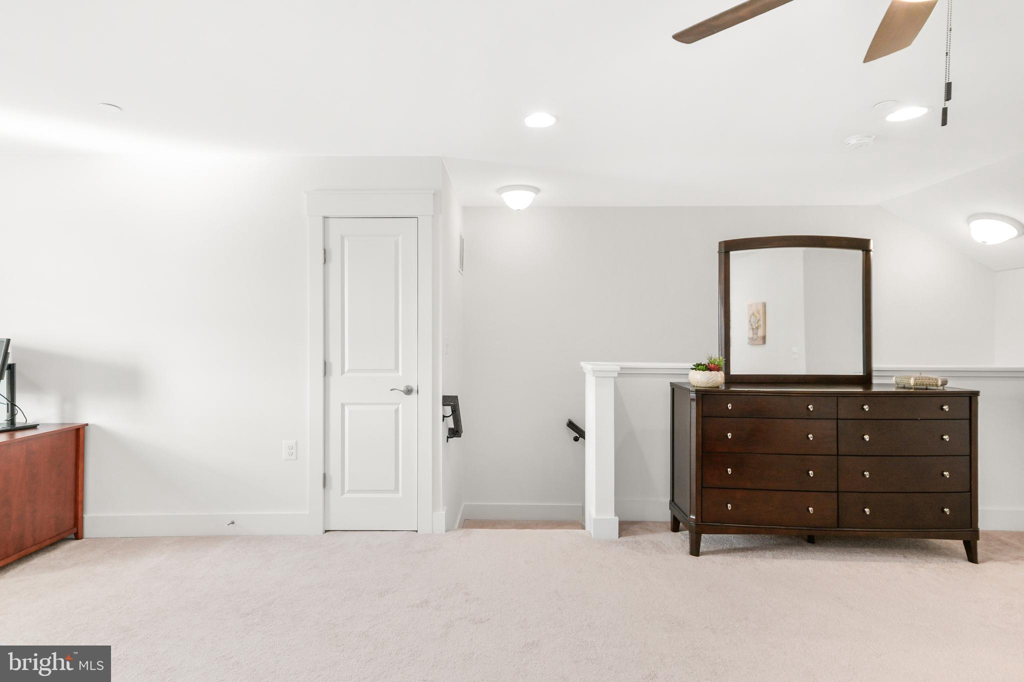 224 East 6th Street Frederick, MD 21701 - Photo 46 of 55 a room with a dresser and a mirror