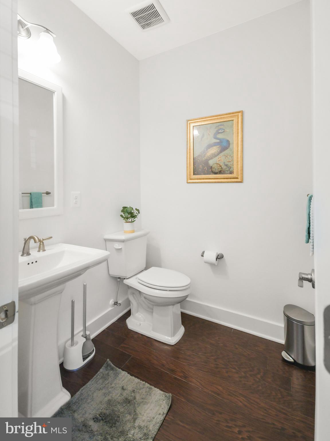 224 East 6th Street Frederick, MD 21701 - Photo 48 of 55 a bathroom with a toilet a sink and mirror