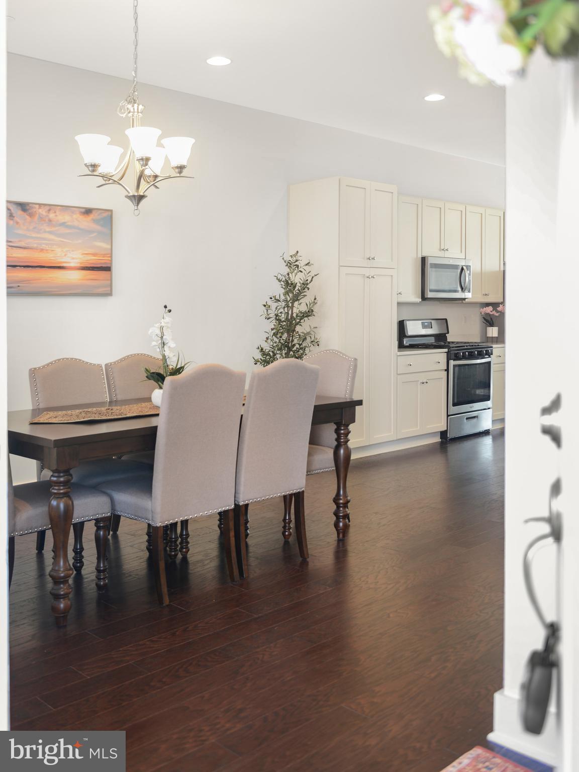 224 East 6th Street Frederick, MD 21701 - Photo 8 of 55 a view of a dining room with furniture and wooden floor