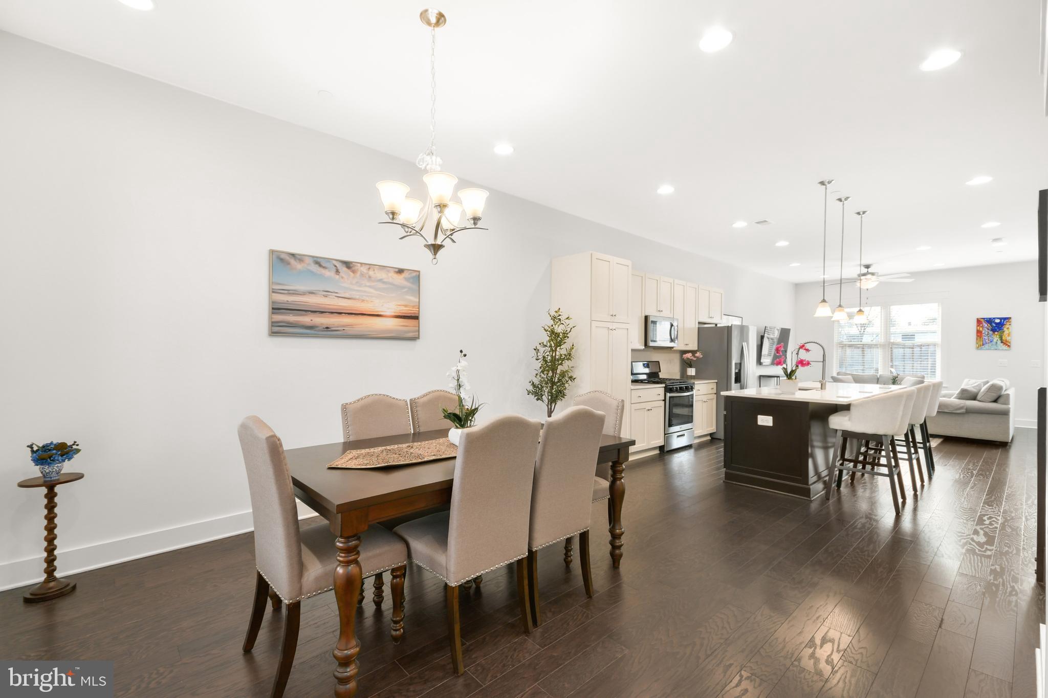 224 East 6th Street Frederick, MD 21701 - Photo 9 of 55 a view of a dining room with furniture and wooden floor