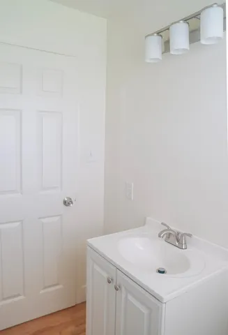 a bathroom with a sink and vanity