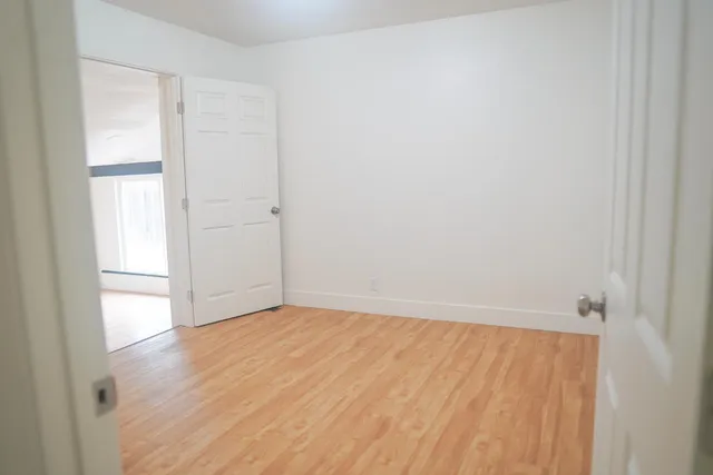 a view of a bathroom from a hallway