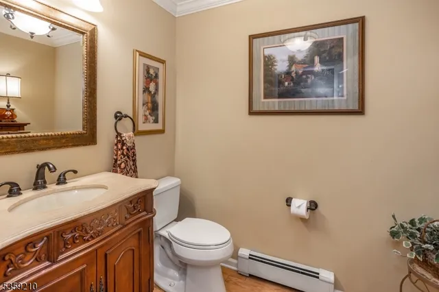 a bed room with a bed and a view of kitchen