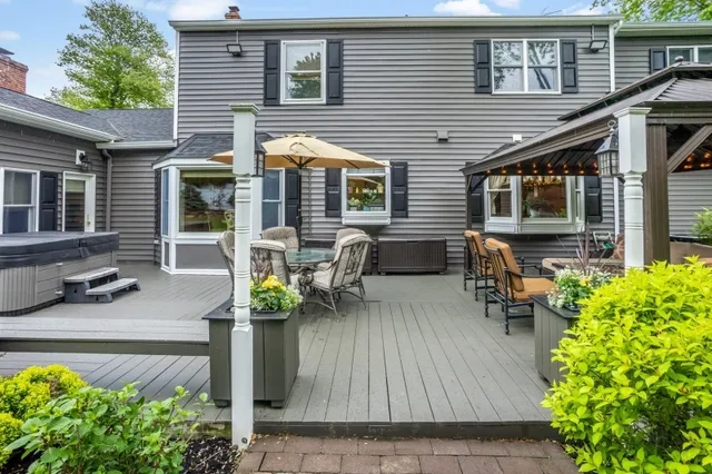 a view of an house with a garden and trees
