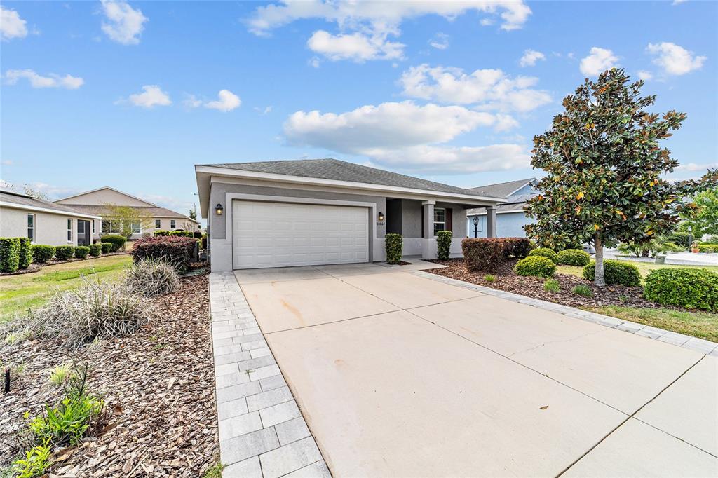 10064 Southwest 88th Street Ocala, FL 34481 - Photo 2 of 47 a house view with a outdoor space