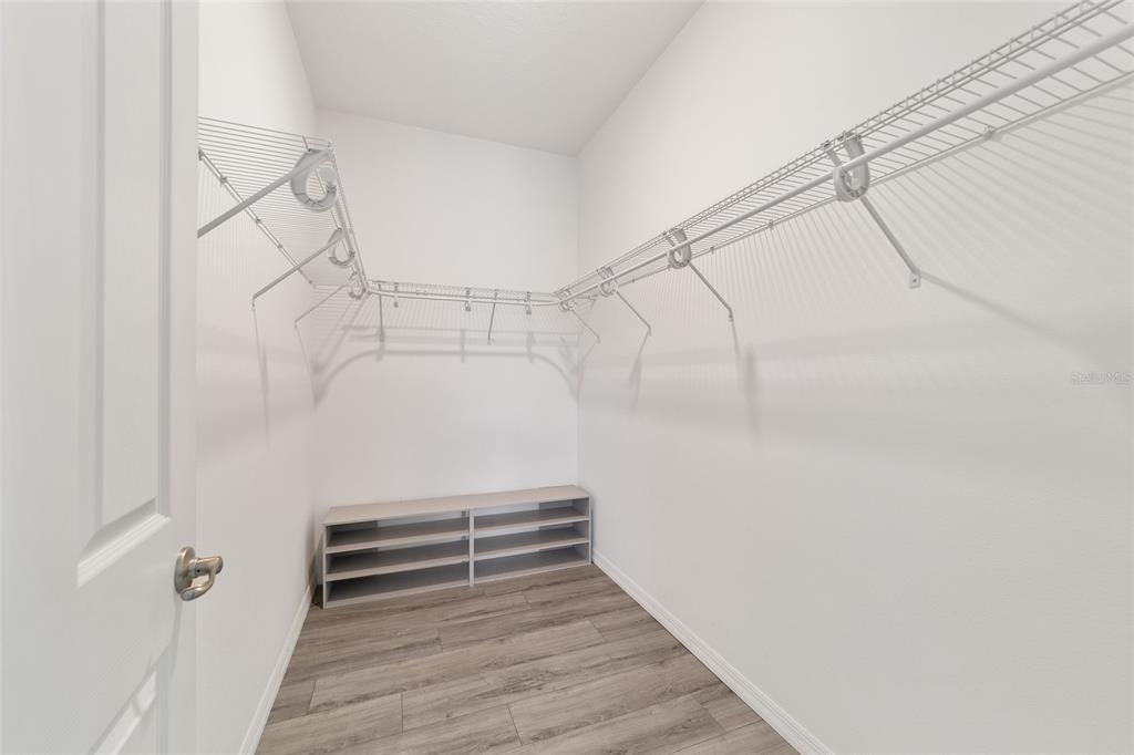 10064 Southwest 88th Street Ocala, FL 34481 - Photo 27 of 47 a view of wooden floor in a room