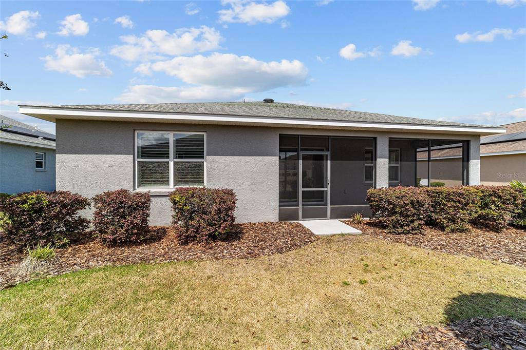 10064 Southwest 88th Street Ocala, FL 34481 - Photo 41 of 47 a house view with a garden space