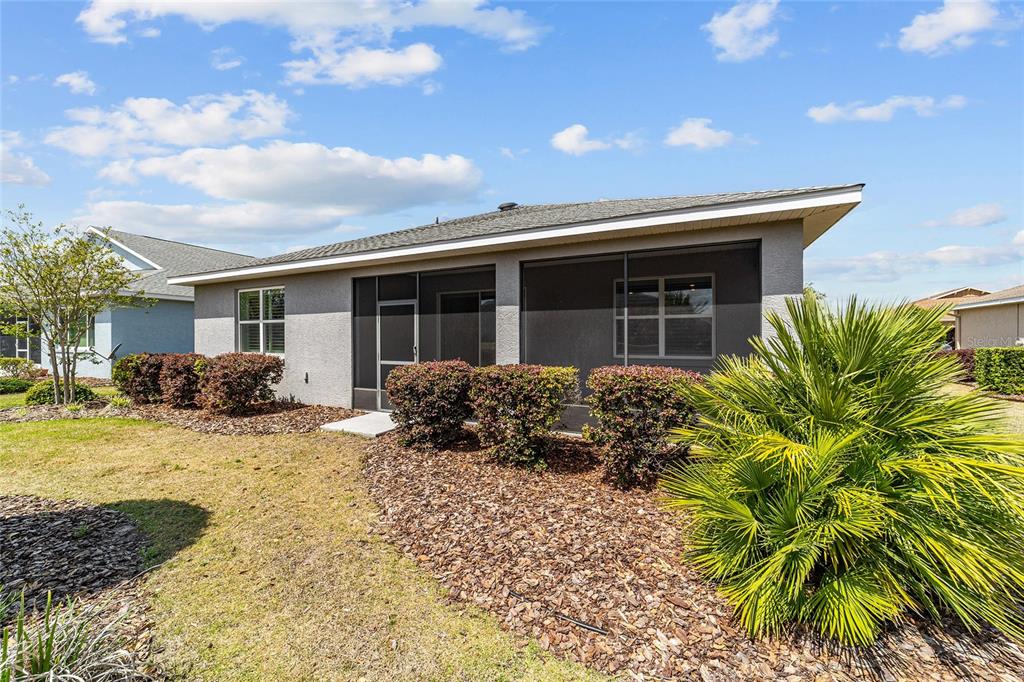 10064 Southwest 88th Street Ocala, FL 34481 - Photo 45 of 47 a view of a house with a patio