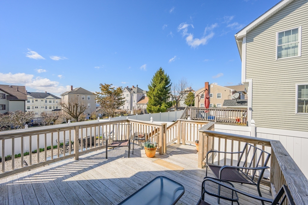 138 Sprague Street Fall River, MA 02724 - Photo 5 of 34 a view of a chair and tables on the roof deck