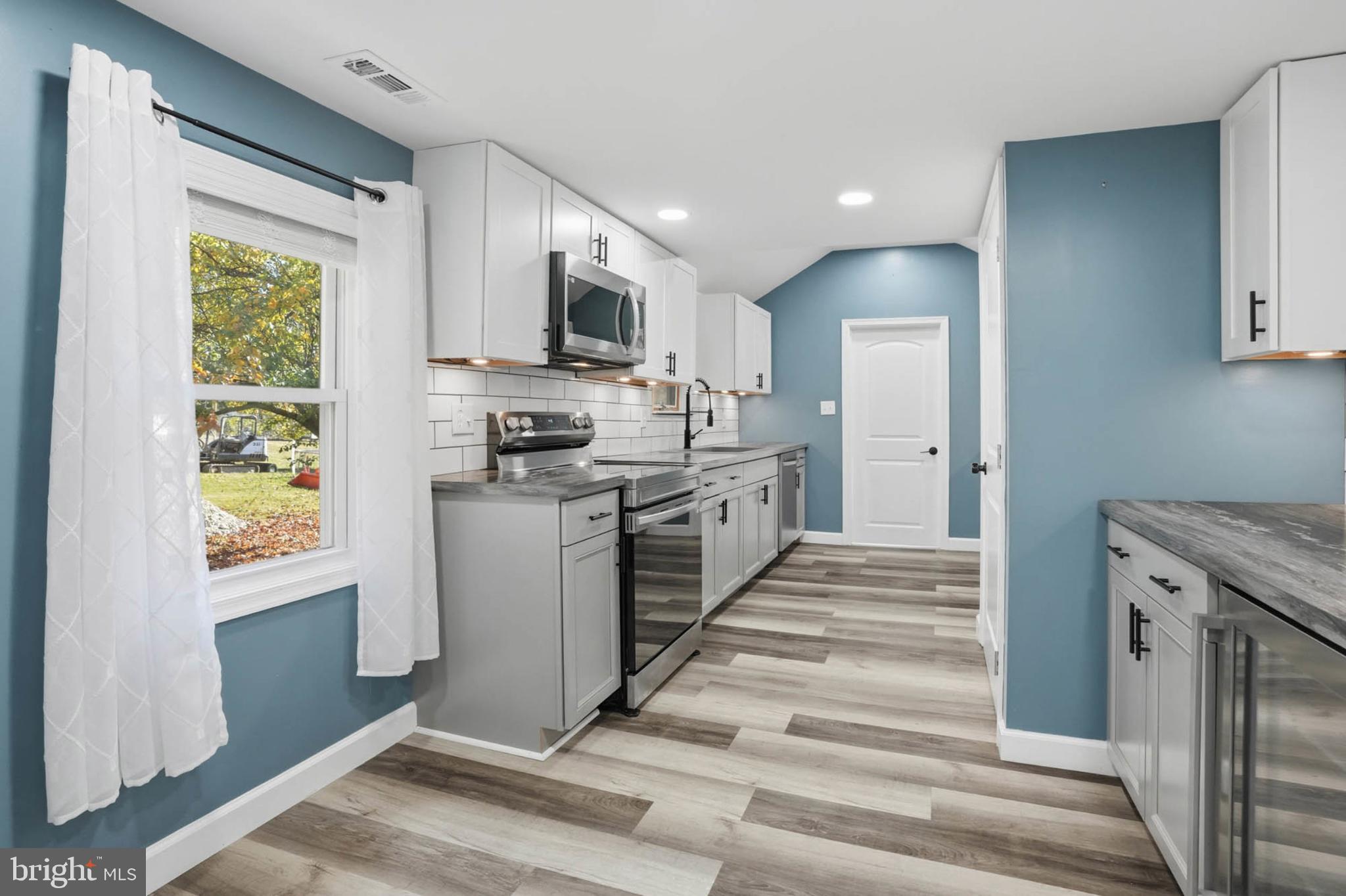 2405 Jerusalem Road Joppa, MD 21085 - Photo 7 of 23 Modern kitchen with stylish blue accents.