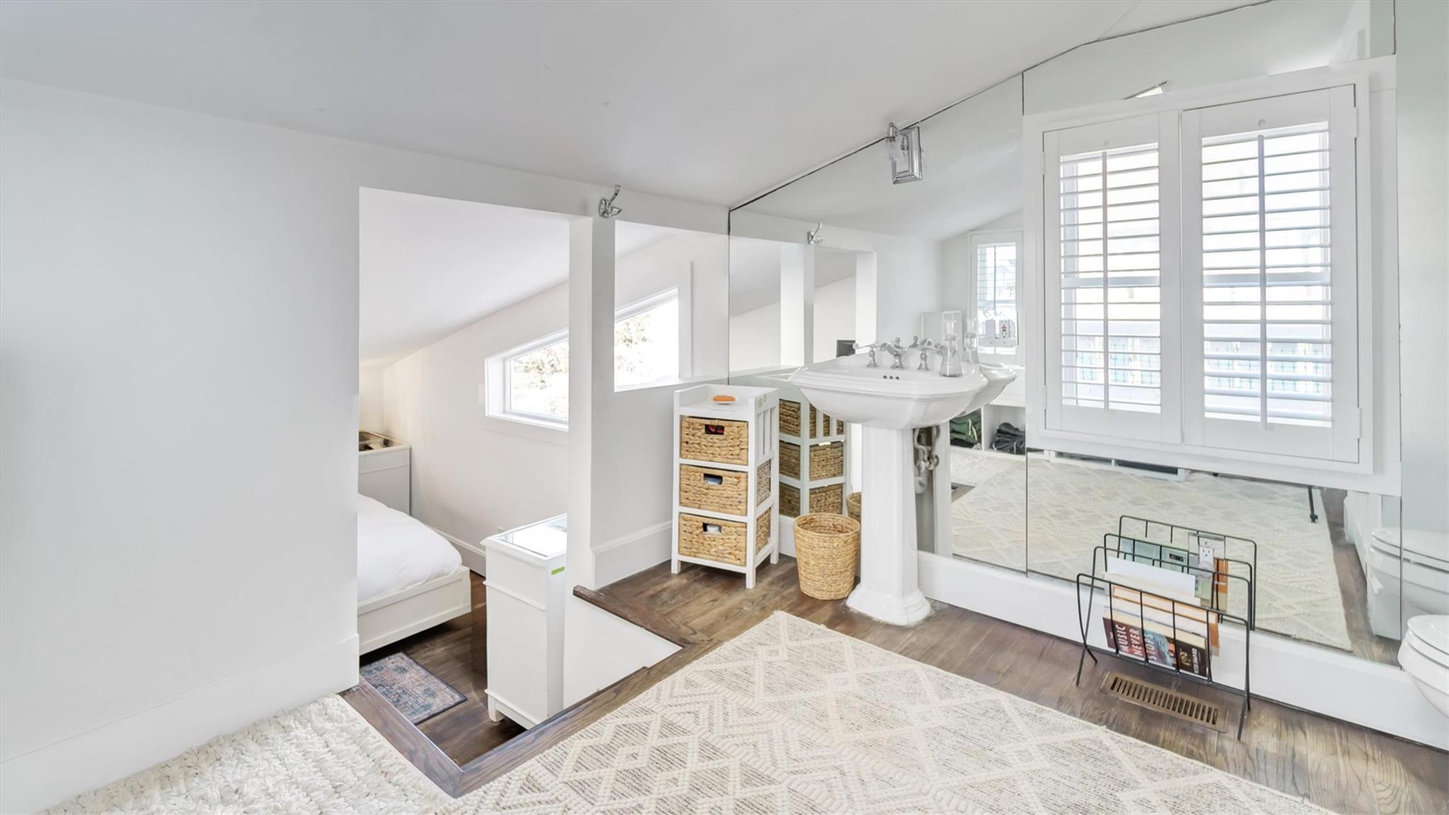 234 Dune Road Quogue, NY 11959 - Photo 14 of 34 a view of a bedroom with furniture and windows