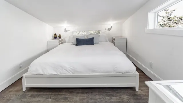a bathroom with a bathtub and window