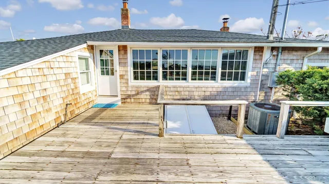 a front view of a house with a swimming pool