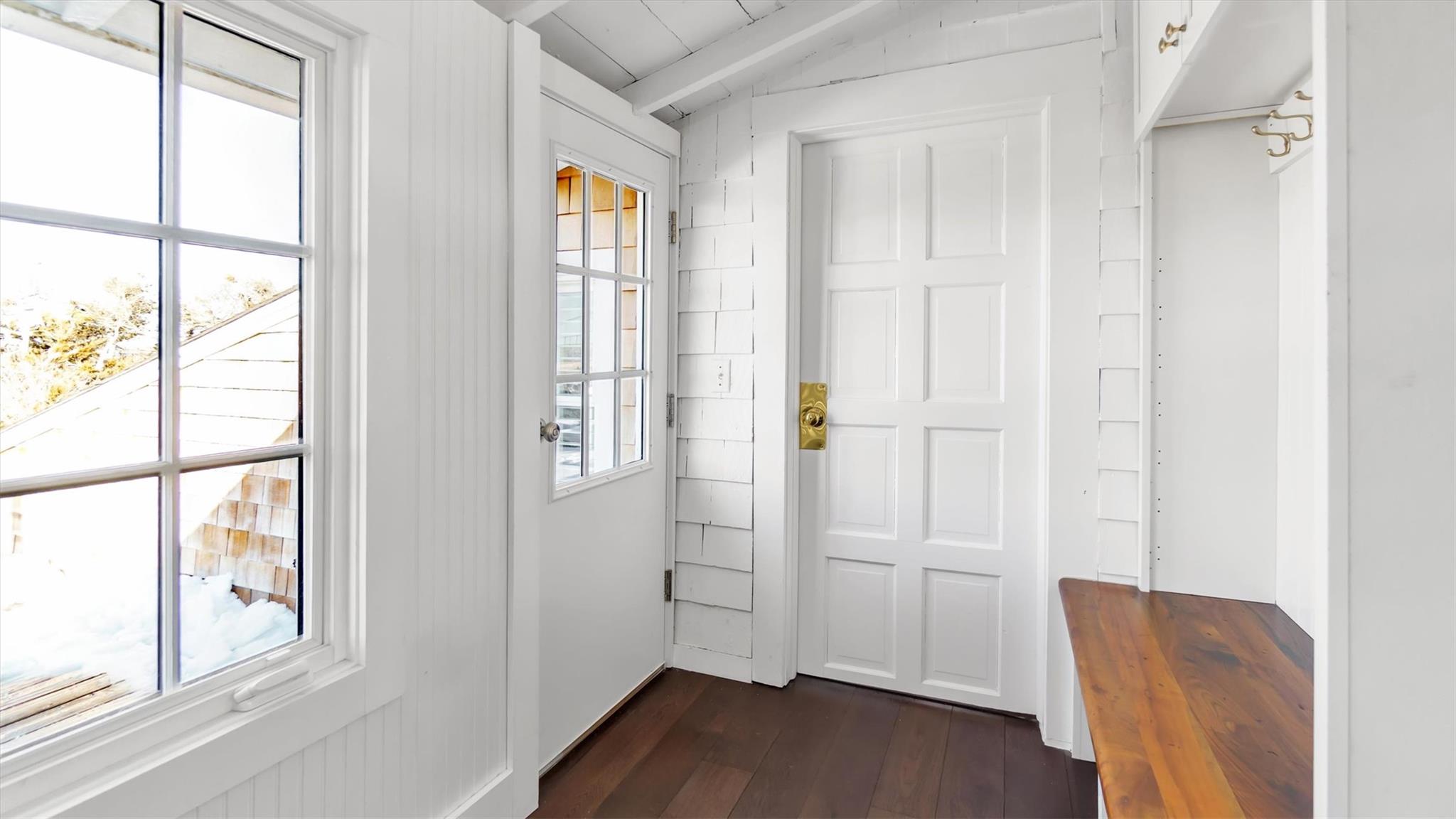 234 Dune Road Quogue, NY 11959 - Photo 5 of 34 a view of empty room with wooden floor and fan