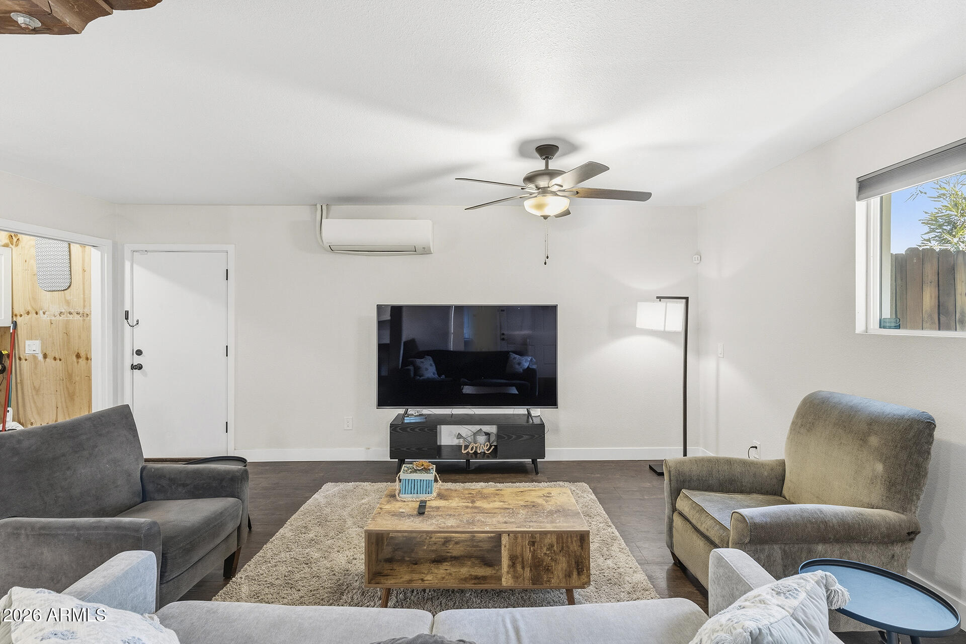 5228 North 15th Street Phoenix, AZ 85014 - Photo 80 of 96 a living room with furniture and a flat screen tv