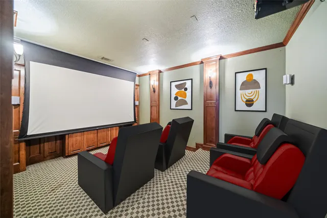 a living room with furniture and painting on the wall