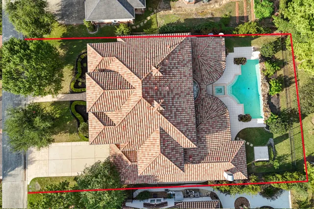 a aerial view of a house with a garden and plants