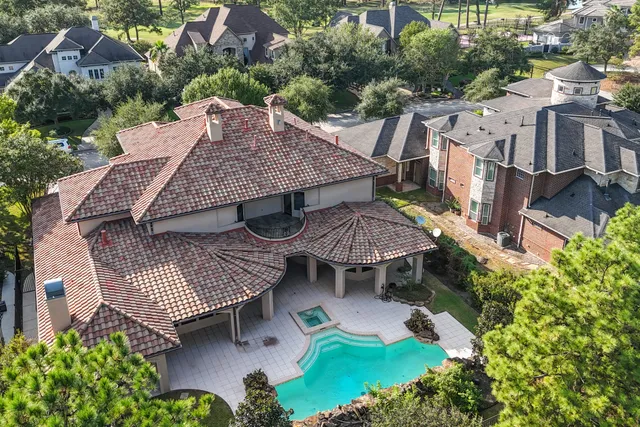 an aerial view of a house having patio and outdoor seating