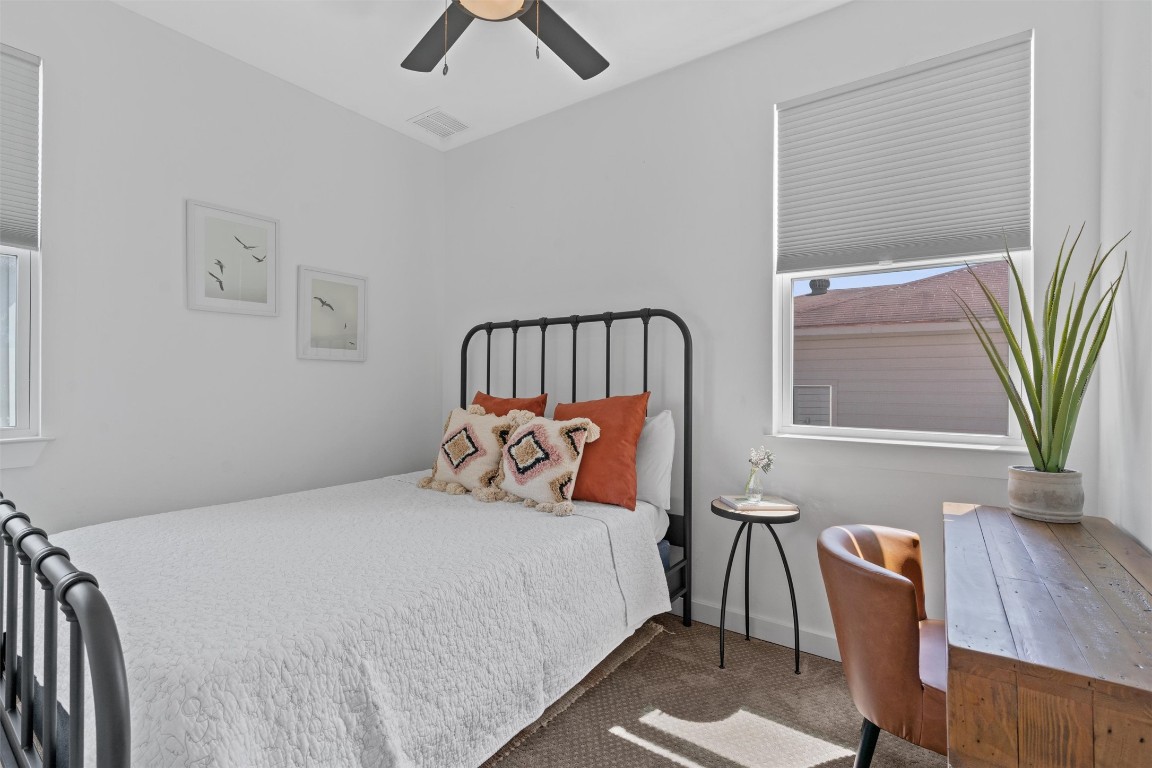 2411 East 11th Street, Unit 1 Austin, TX 78702 - Photo 11 of 17 a bed sitting in a bedroom next to a window