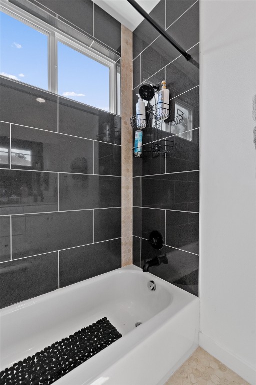 2411 East 11th Street, Unit 1 Austin, TX 78702 - Photo 13 of 17 a bathroom with a bathtub and a shower