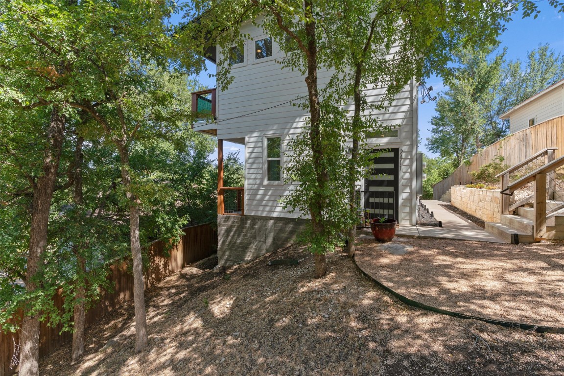 2411 East 11th Street, Unit 1 Austin, TX 78702 - Photo 15 of 17 a backyard of a house with lots of trees