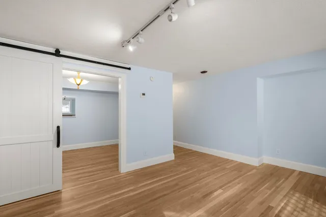 a kitchen with a white cabinets and white appliances