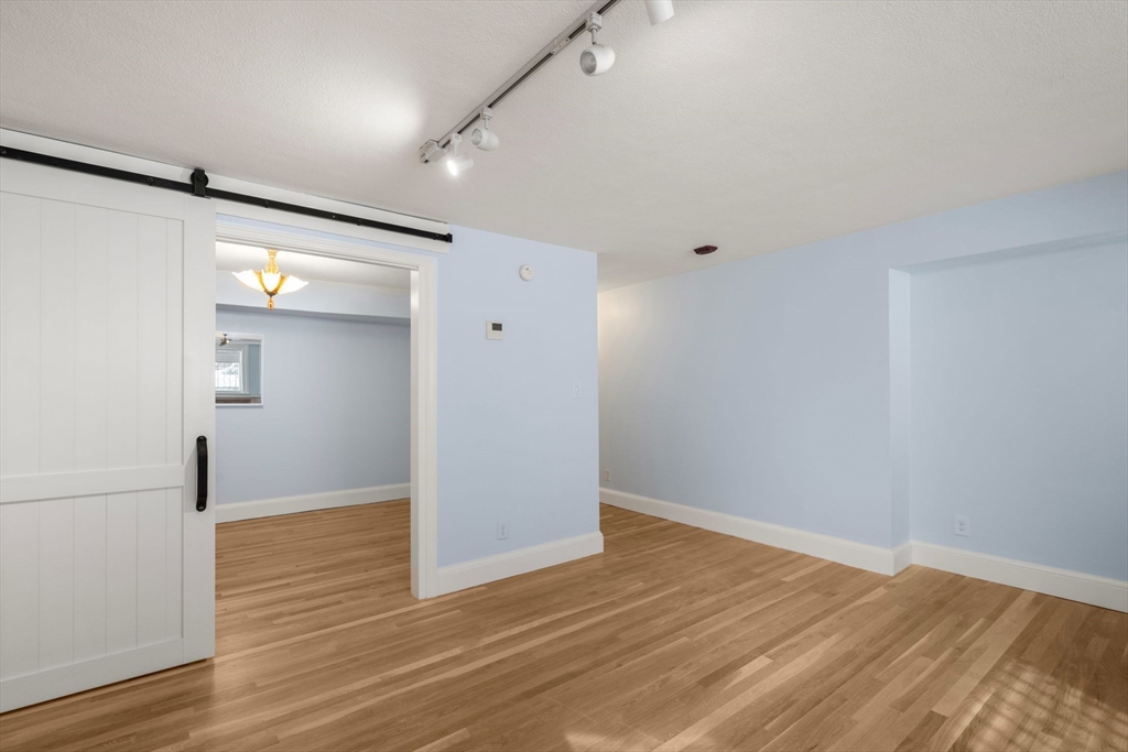 242 Beacon Street, Unit 1 Boston, MA 02116 - Photo 13 of 29 wooden floor in an empty room