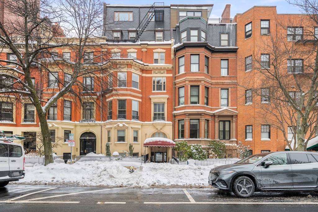 242 Beacon Street, Unit 1 Boston, MA 02116 - Photo 29 of 29 a front view of a residential apartment building with yard