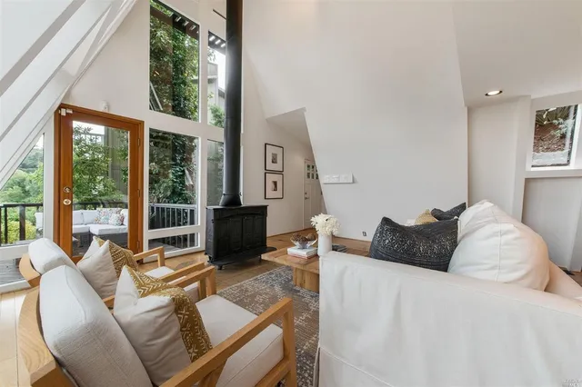 a bedroom with a bed and glass window