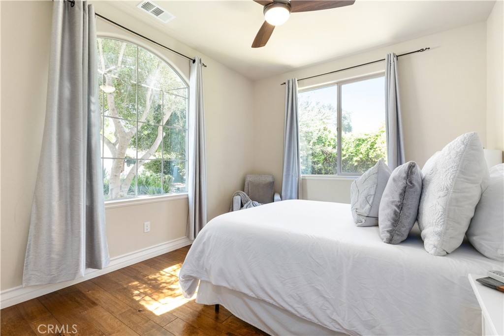 669 Red Cloud Road Paso Robles, CA 93446 - Photo 28 of 61 a bedroom with a bed and wooden floor