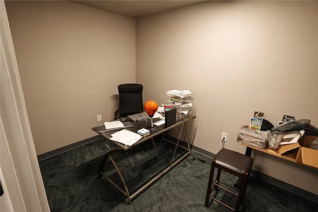 a room with a table and chairs