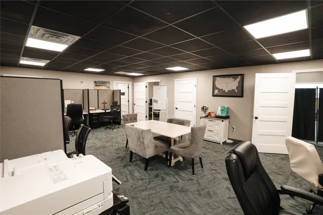 a living room with furniture and a table