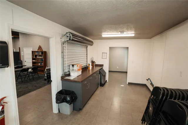 a living room with furniture and a mirror