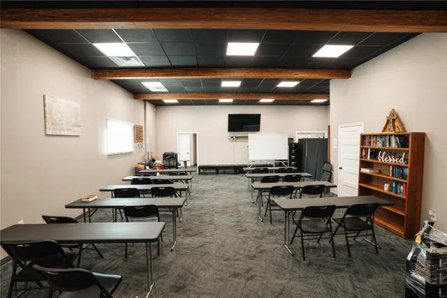a kitchen with a table and chairs in it